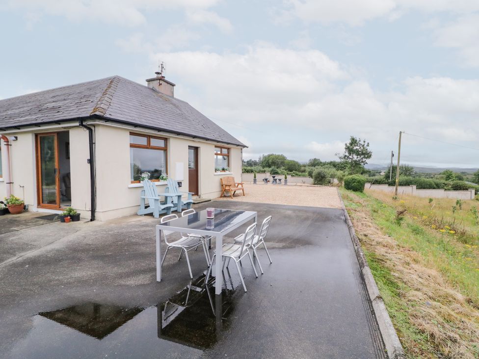 An outdoor area with a table and chairs at Ard na Gréine in Glenties, County Donegal