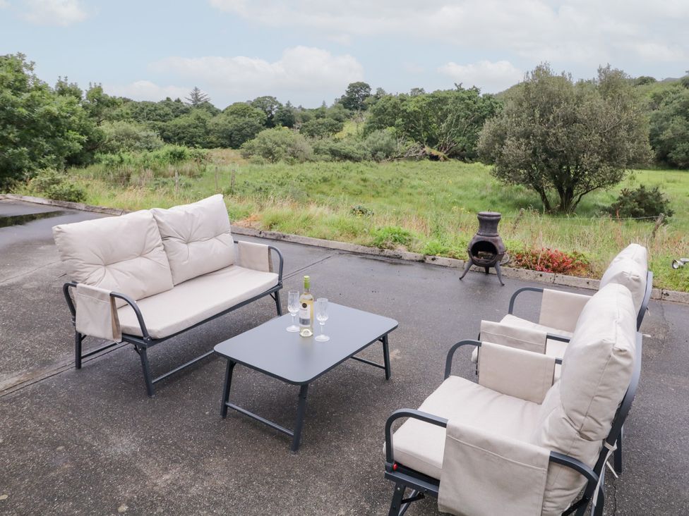 An outdoor seating area with a sofa, chairs, and a table at Ard na Gréine, Glenties, County Donegal