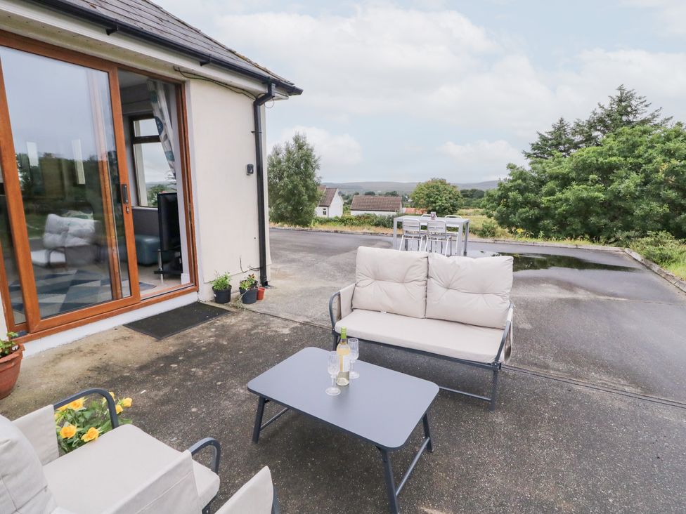 An outdoor seating area with a sofa and table at Ard na Gréine, Glenties, County Donegal