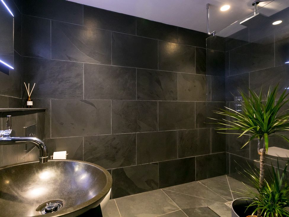 A bathroom with a sink and shower at Scilly Stack in Penzance