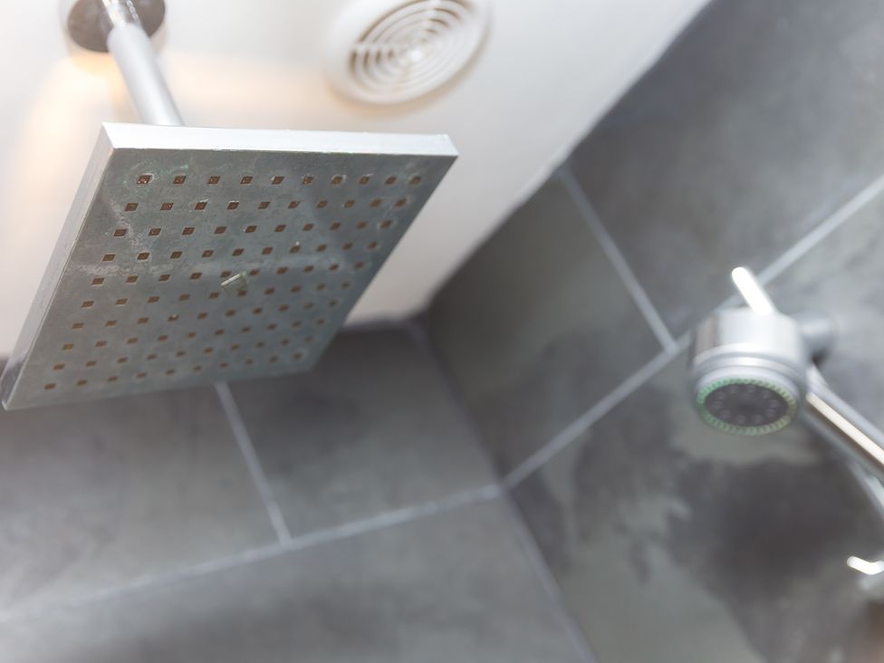 A shower configuration with a square shower head and nozzle at Scilly Stack in Penzance