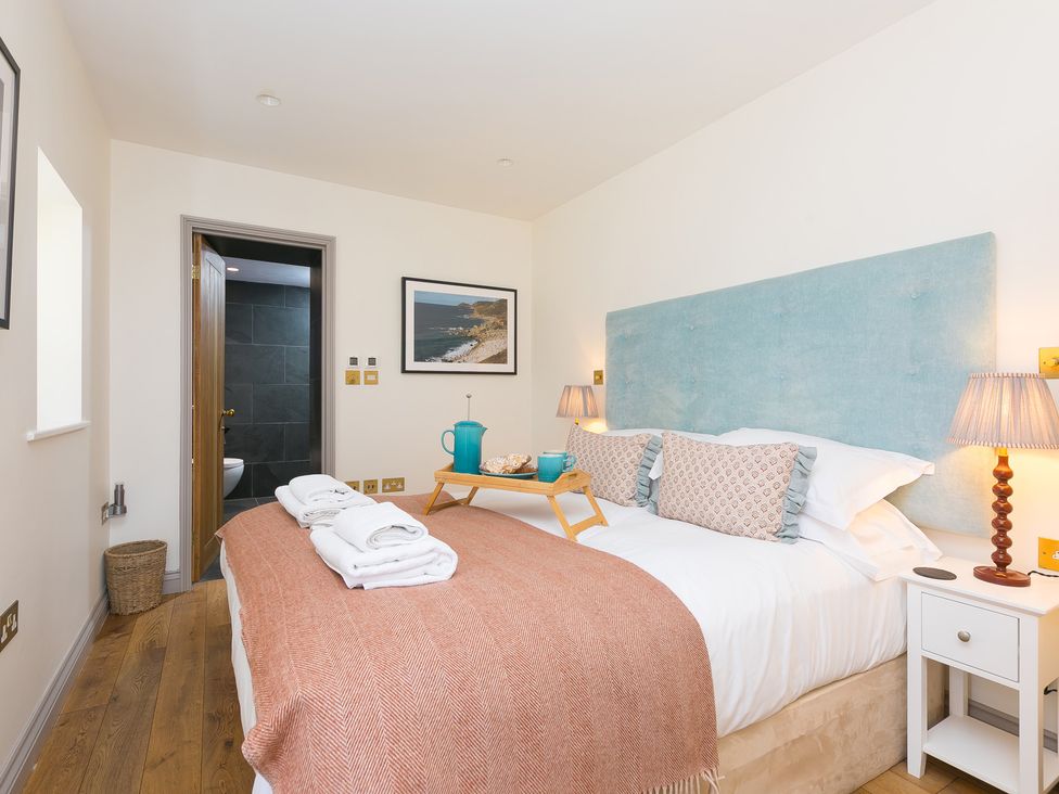 A bedroom with a bed and tea set at Scilly Stack in St Just