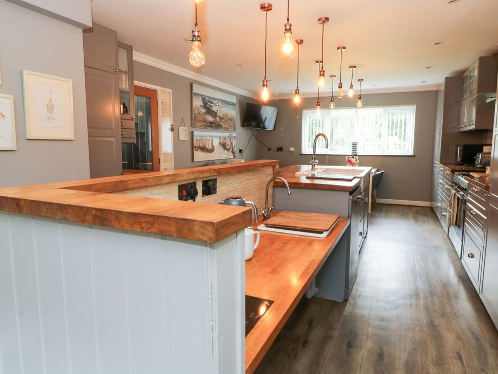 A kitchen with a sink and cooking hob at Tynewydd Fields in Cross Inn