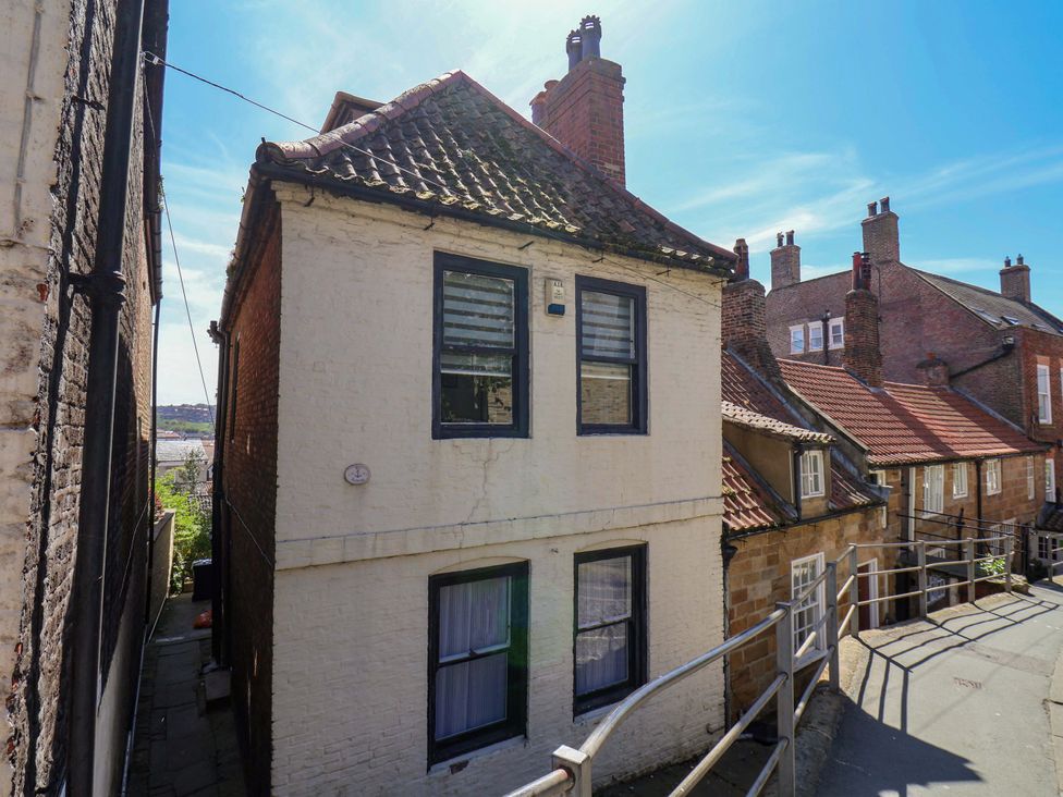 A view of a house with windows and a surrounding pathway at The Anchorage in Whitby
