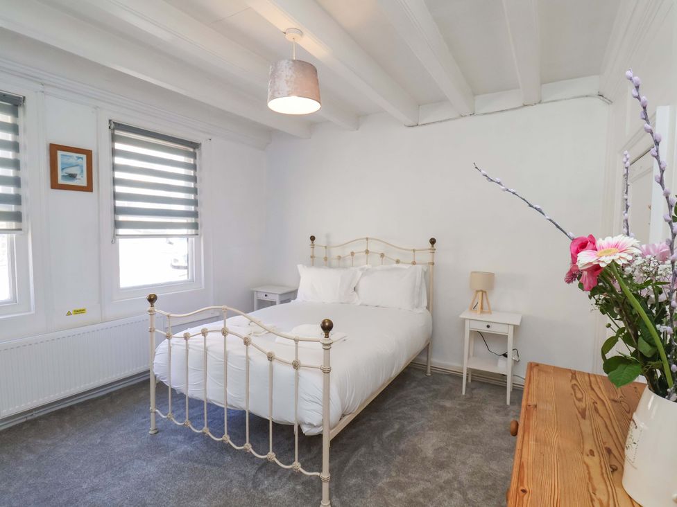 A bedroom with a bed and nightstand at The Anchorage in Whitby
