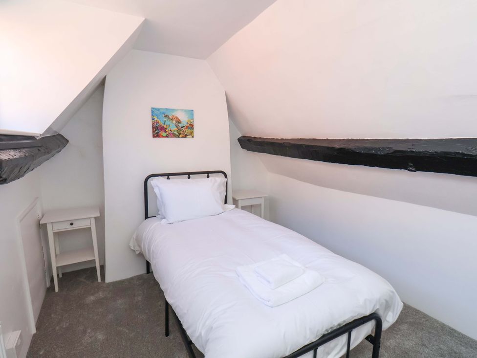 A bedroom with a bed and bedside table at The Anchorage in Whitby