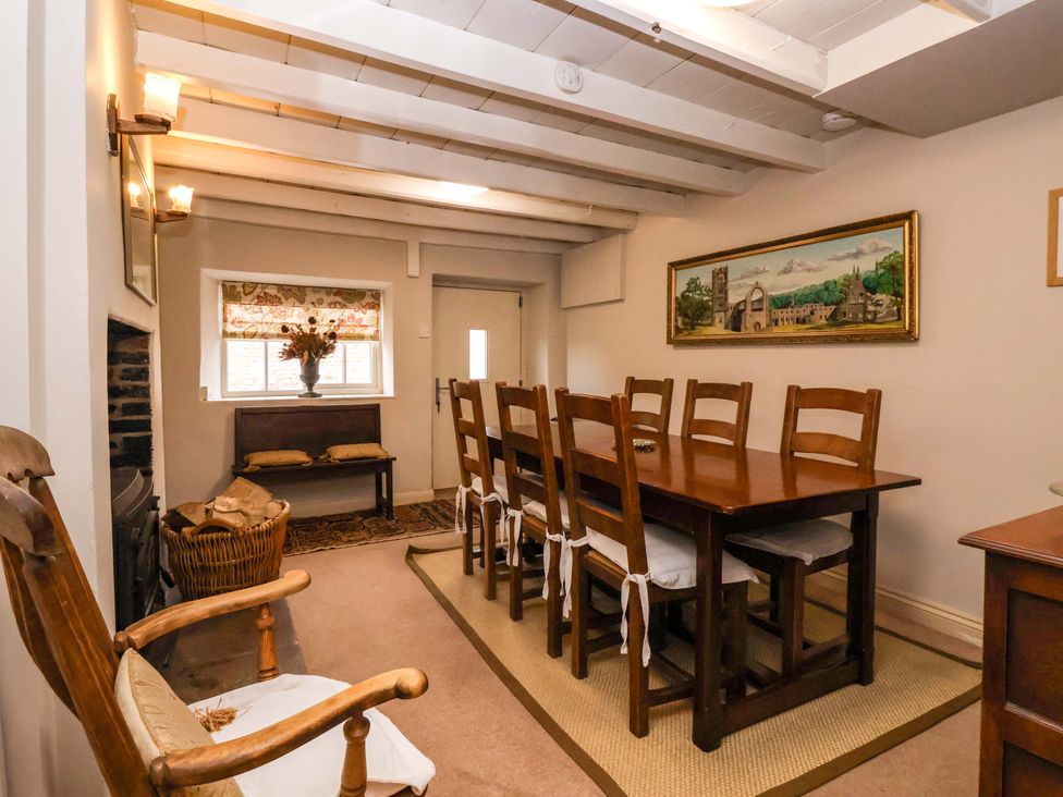 A dining room with a table and chairs at Dunning, The Mount York