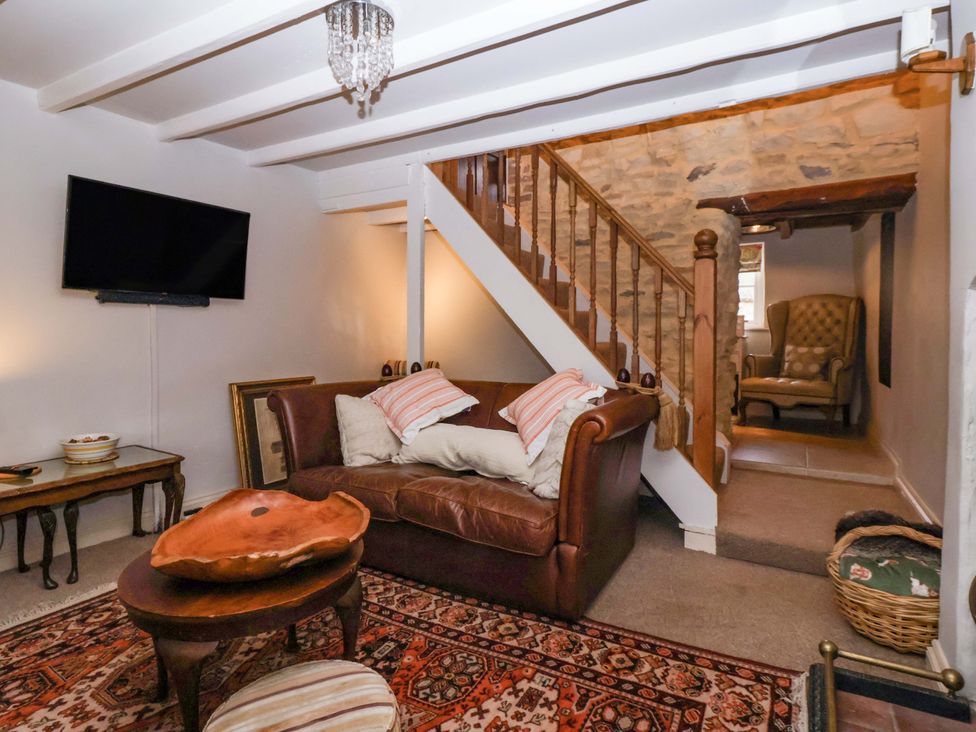 A living room with a sofa and television at Dunning, The Mount in York