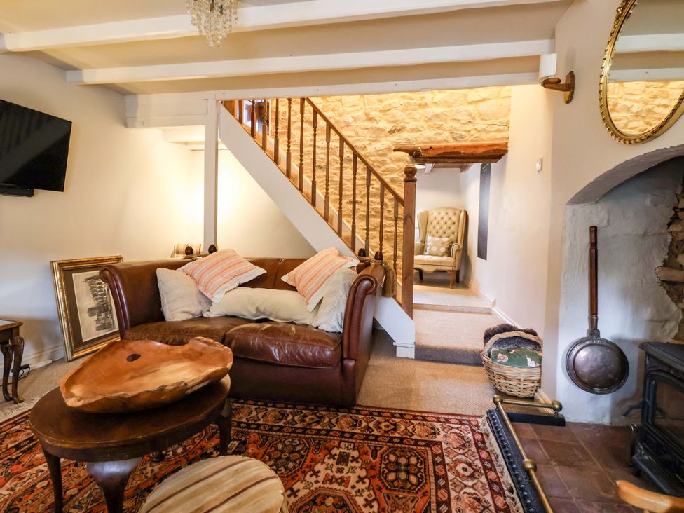 A living room with a sofa and stairs at Dunning, The Mount in York