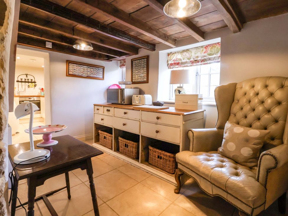 A snug with an armchair and a table in Dunning, The Mount, York