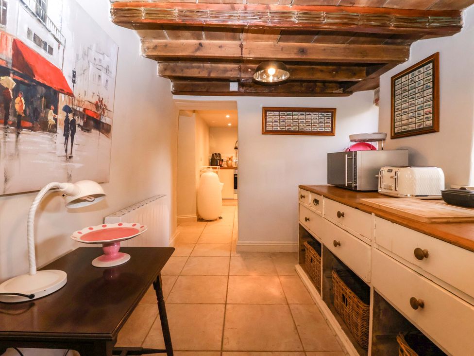 A kitchen with assorted appliances and storage at Dunning, The Mount York