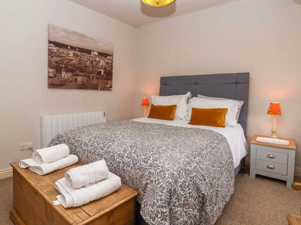 A bedroom with a bed and bedside tables at Dunning, The Mount, York