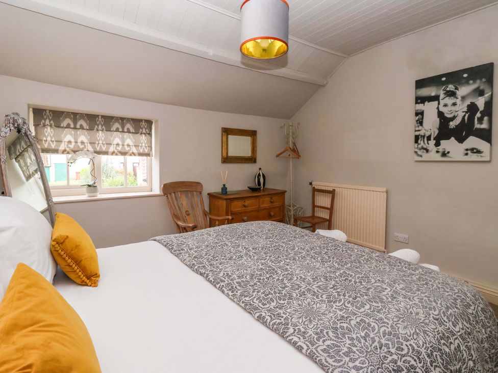A bedroom with a bed and dresser at Dunning, The Mount York