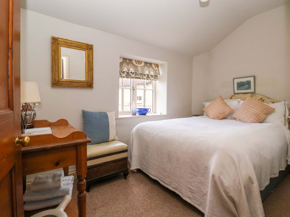 A bedroom with a bed and window at Dunning, The Mount, York
