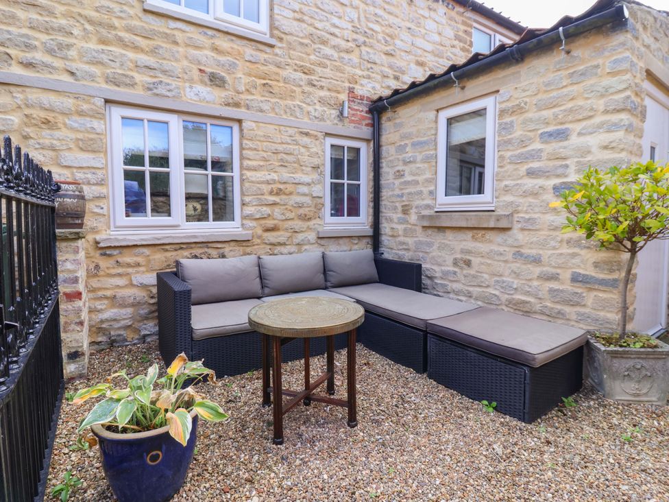 An outdoor seating area with a couch and table at Dunning, The Mount, York