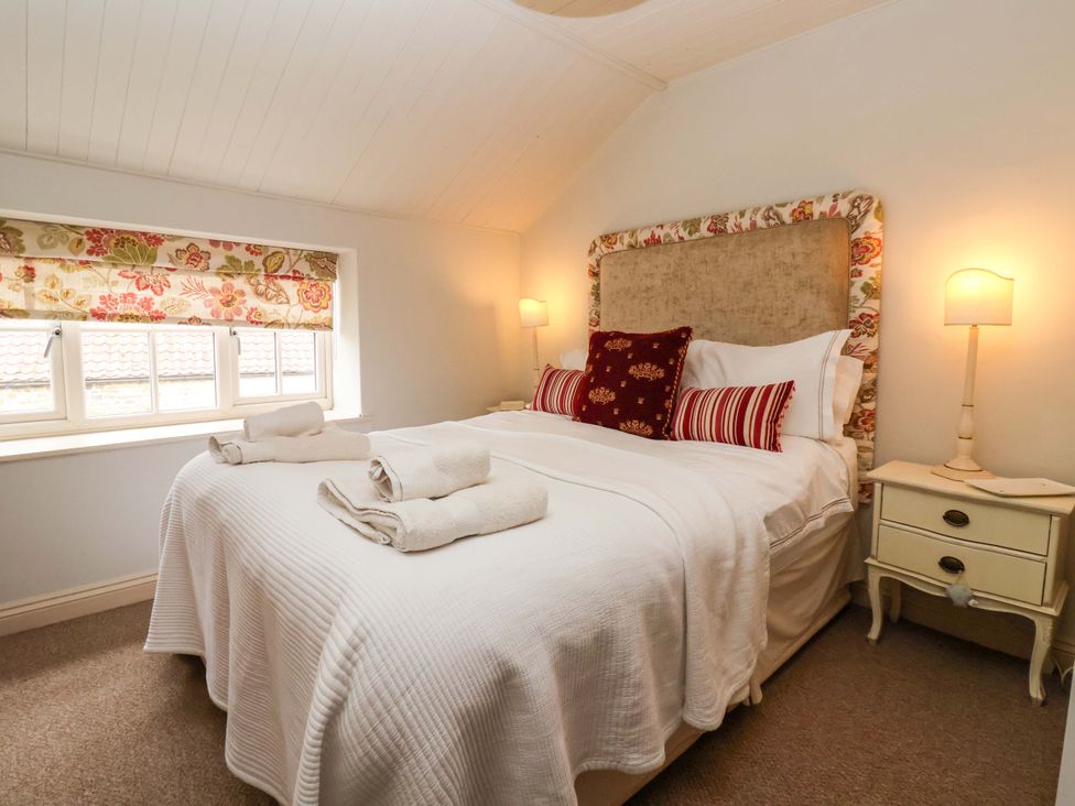 A bedroom with a bed and bedside table at Dunning, The Mount in York
