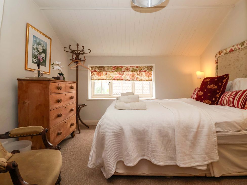 A bedroom with a bed and a dresser at Dunning, The Mount in York