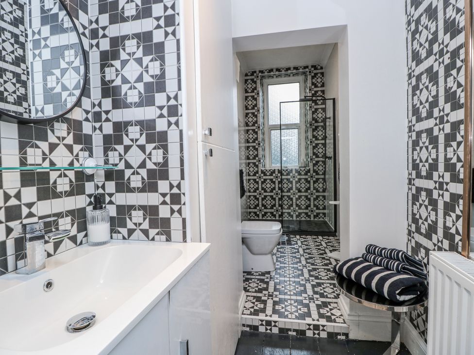 A bathroom with a sink and a toilet at No. 5 Cliffview in Ventnor