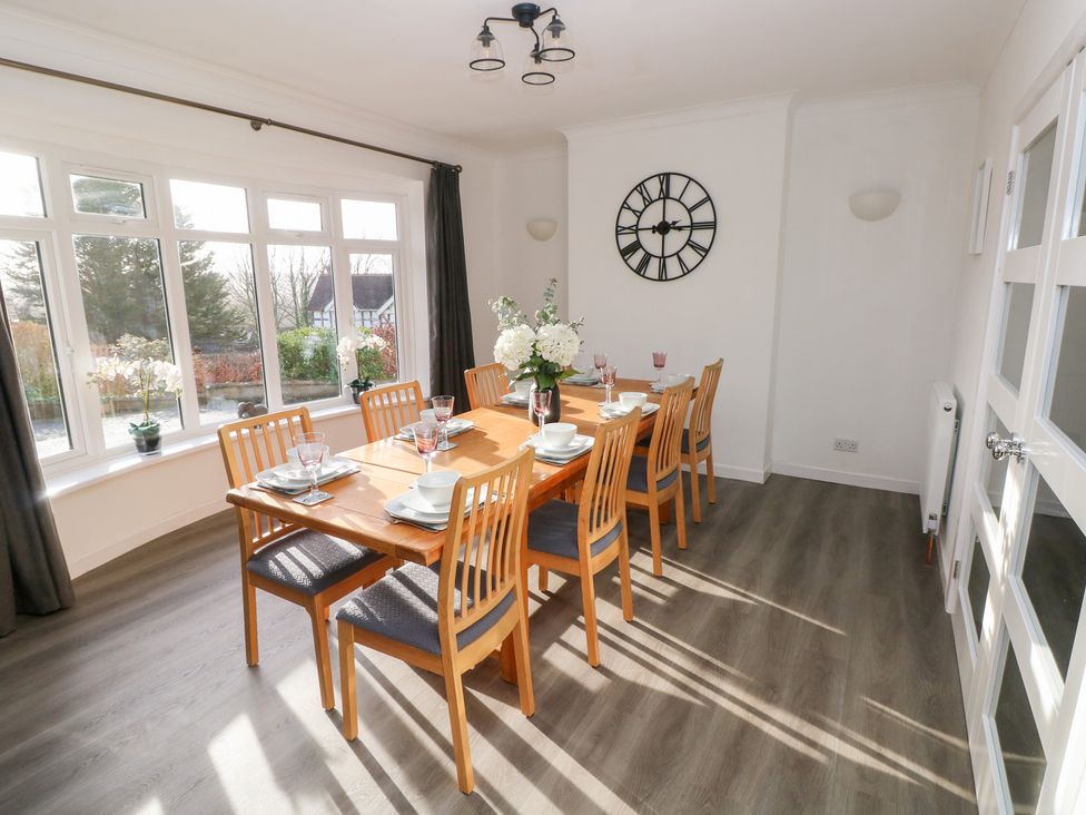 A dining room with a table set for dining at Westwinds Tenby