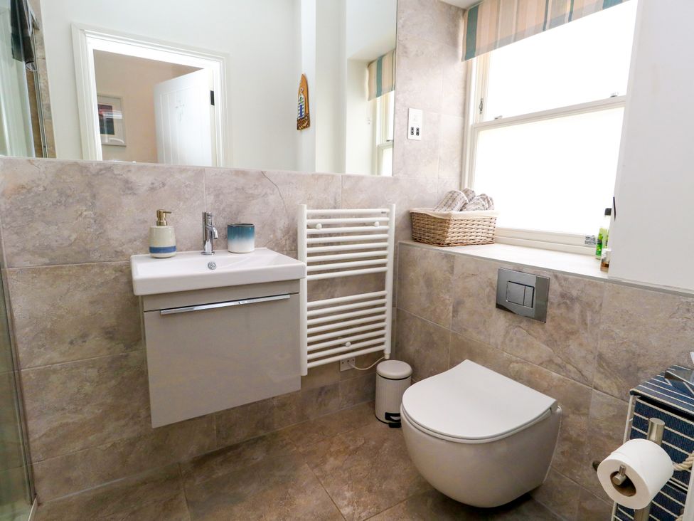 A bathroom with a sink and toilet at 4 The Beaches in Weymouth