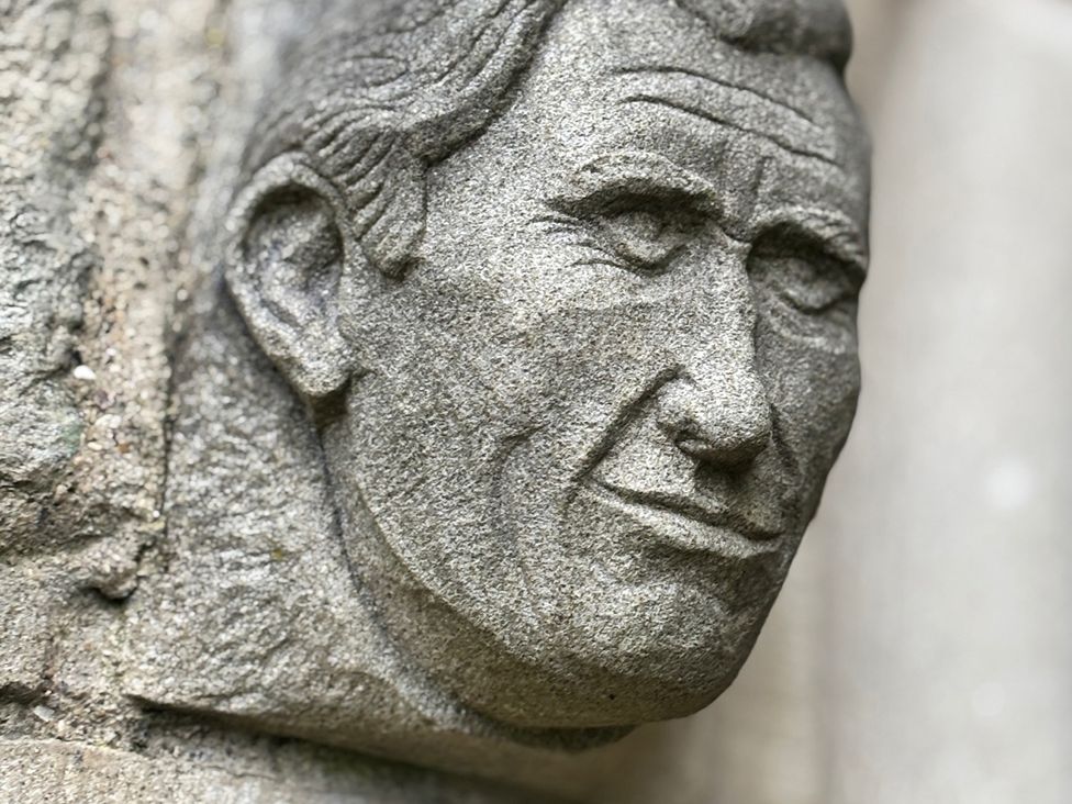 A stone sculpture of a face at Bobbies Retreat, 20 High Street, Bridlington