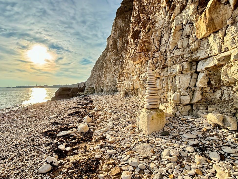 A beach scene with a rock stack and cliffs at Bobbies Retreat, 20 High Street, Bridlington