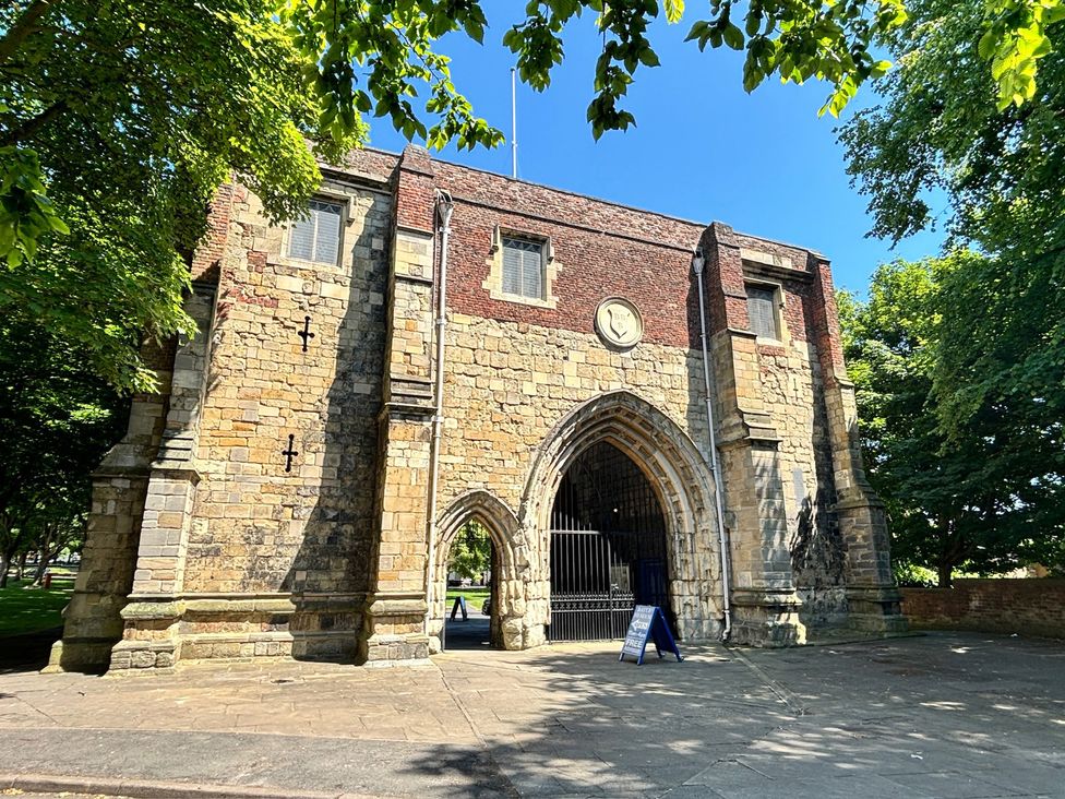 An old stone building with a large archway at Bobbies' Retreat, 20 High Street in Bridlington