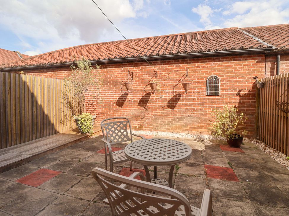 A garden with a table and chairs at 8 Williamson Drive, Ripon