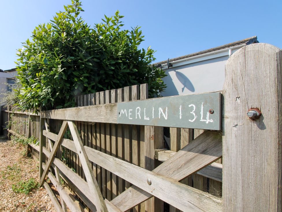 A gate with a sign reading Merlin 134 in the garden at Merlin in Malborough