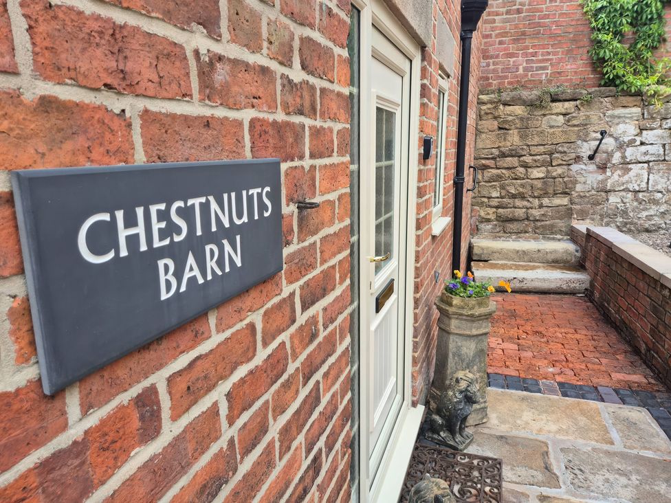 An entrance with a sign reading Chestnuts Barn and steps at Chestnuts Barn Holbrook, Derbyshire