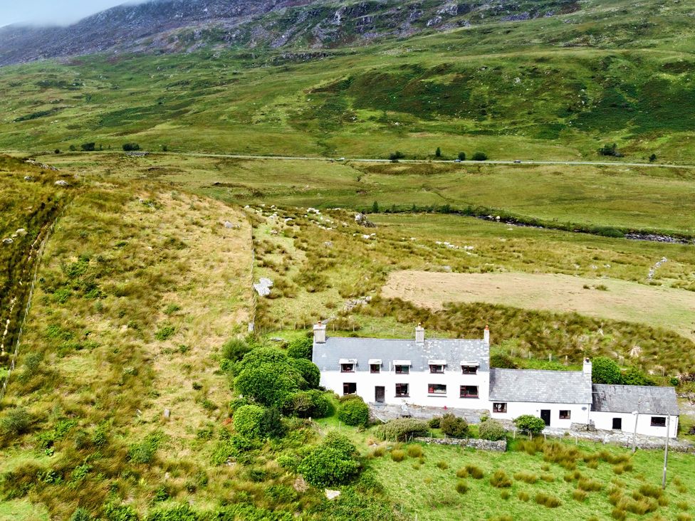 A house surrounded by fields and hills at Cwm in Capel Curig
