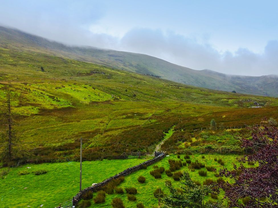 A landscape with mountains and a path at Cwm in Capel Curig