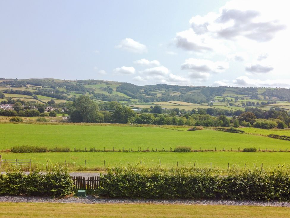 A view of fields and hills at Pengwern Bach in Llanrwst