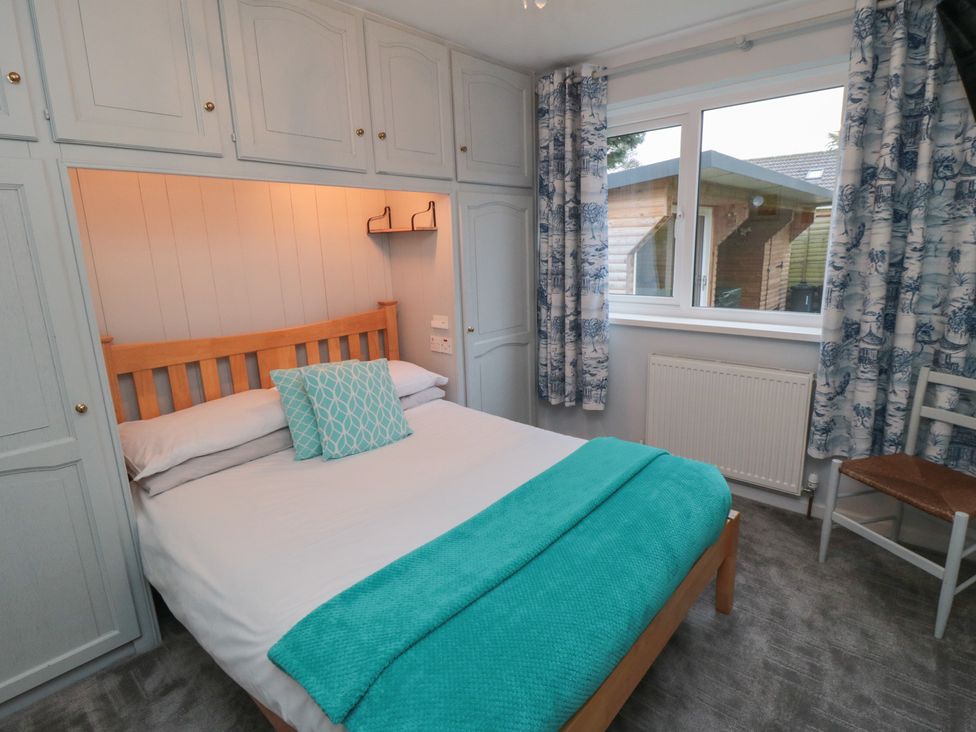 A bedroom with a bed and window at 17 Costa Way Pickering