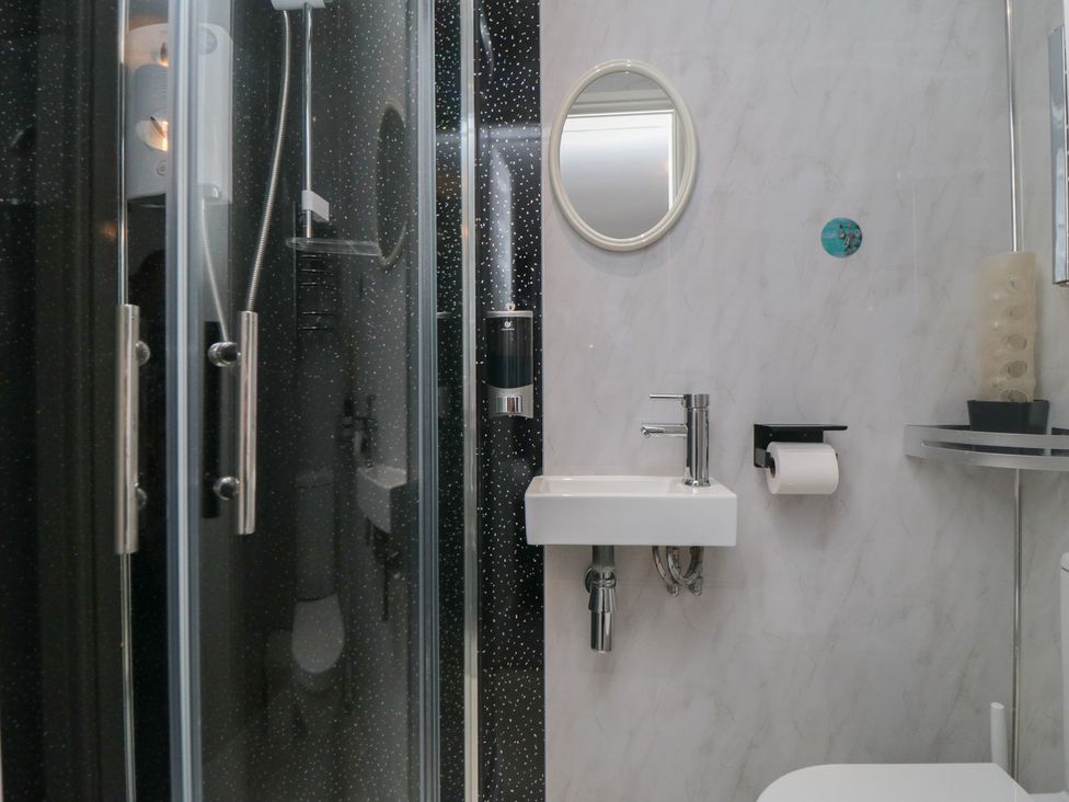 A bathroom with a sink and shower at 17 Costa Way in Pickering