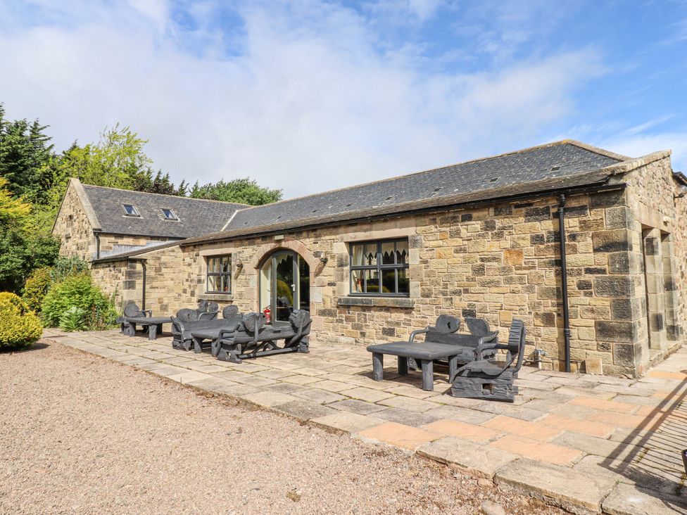 A patio with furniture at Cherryburn Cottage in Akeld near Wooler