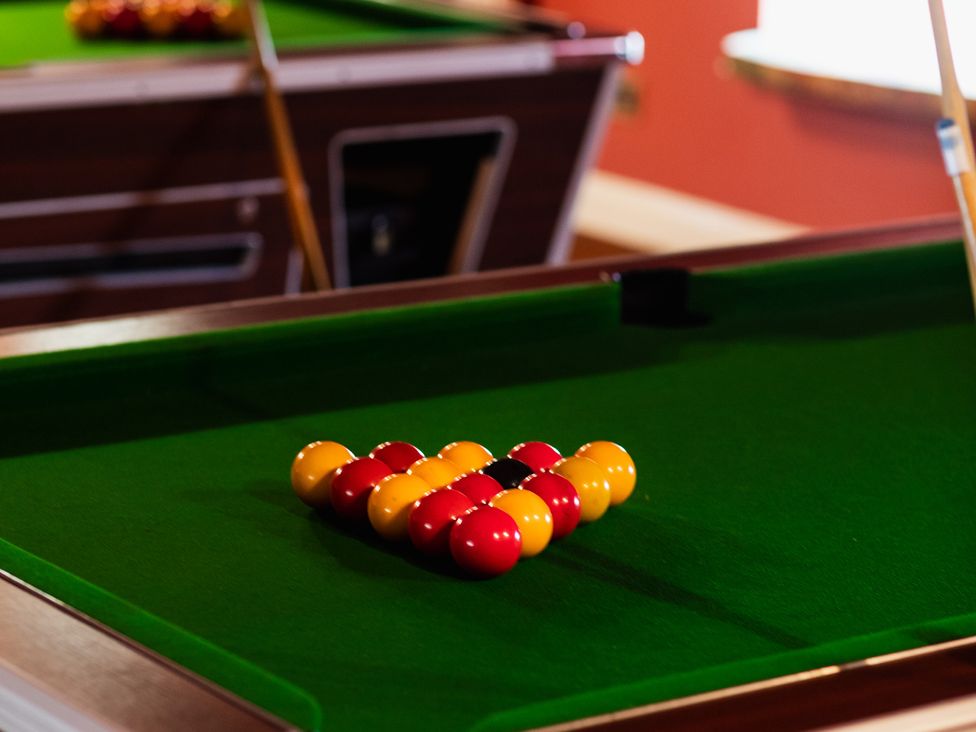 A pool table with balls arranged at Tile Rouge in Wooler