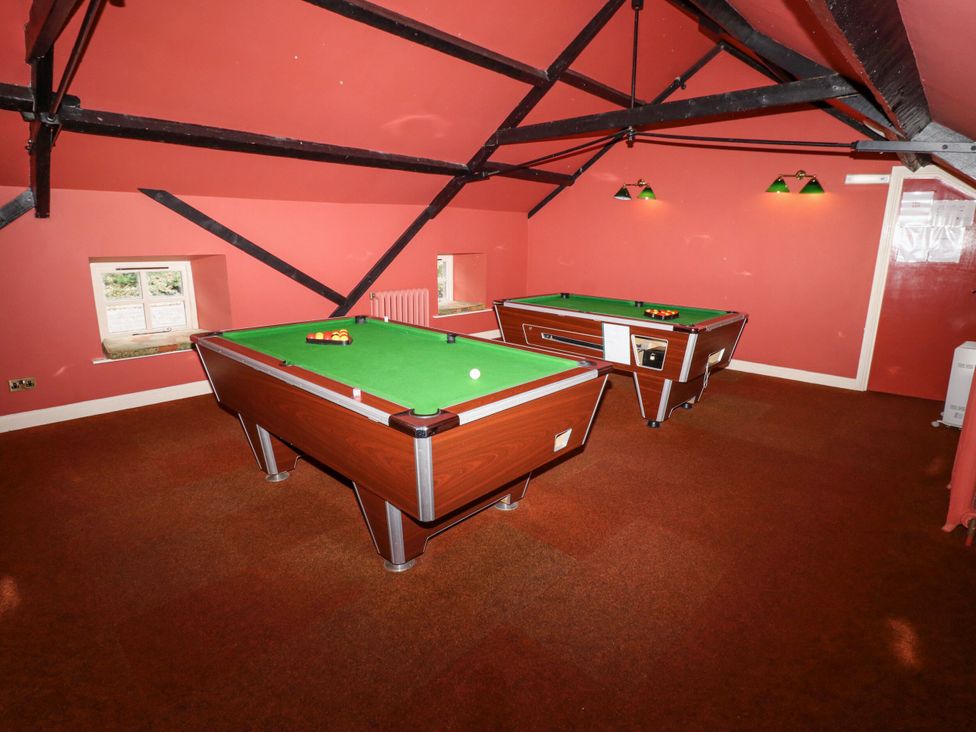 A games room with two pool tables at Hollyhock in Akeld near Wooler