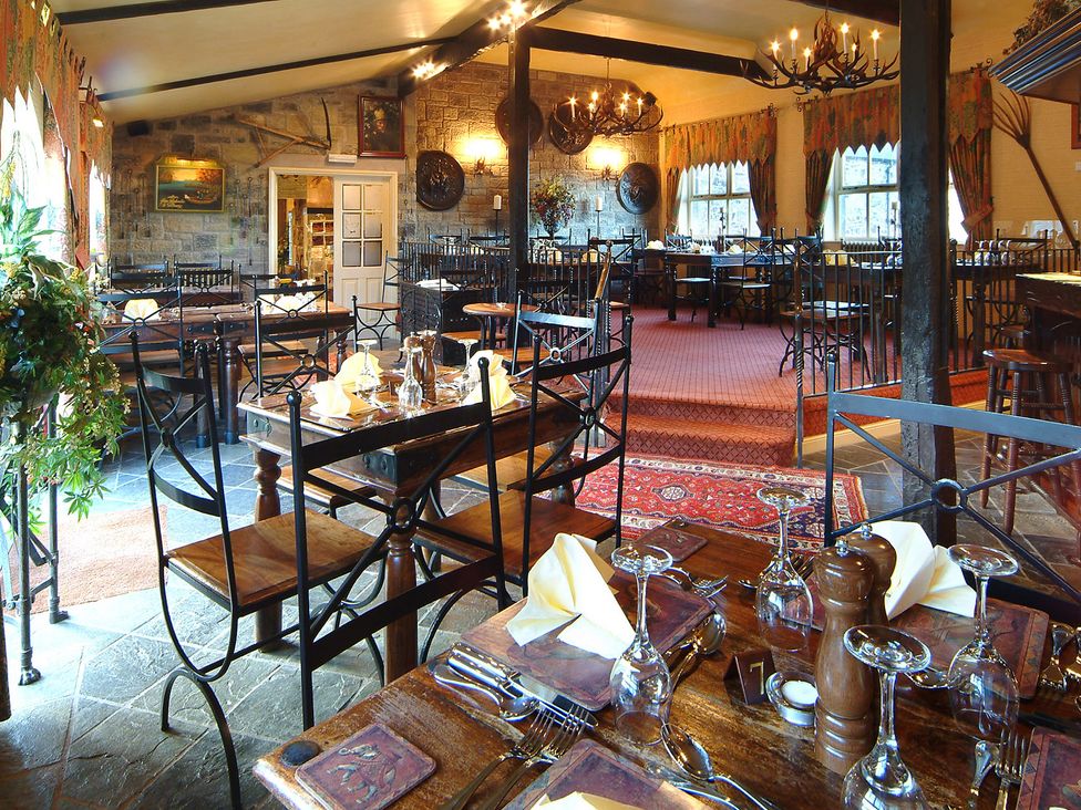 A dining room with tables and chairs set at Heatherview in Akeld near Wooler
