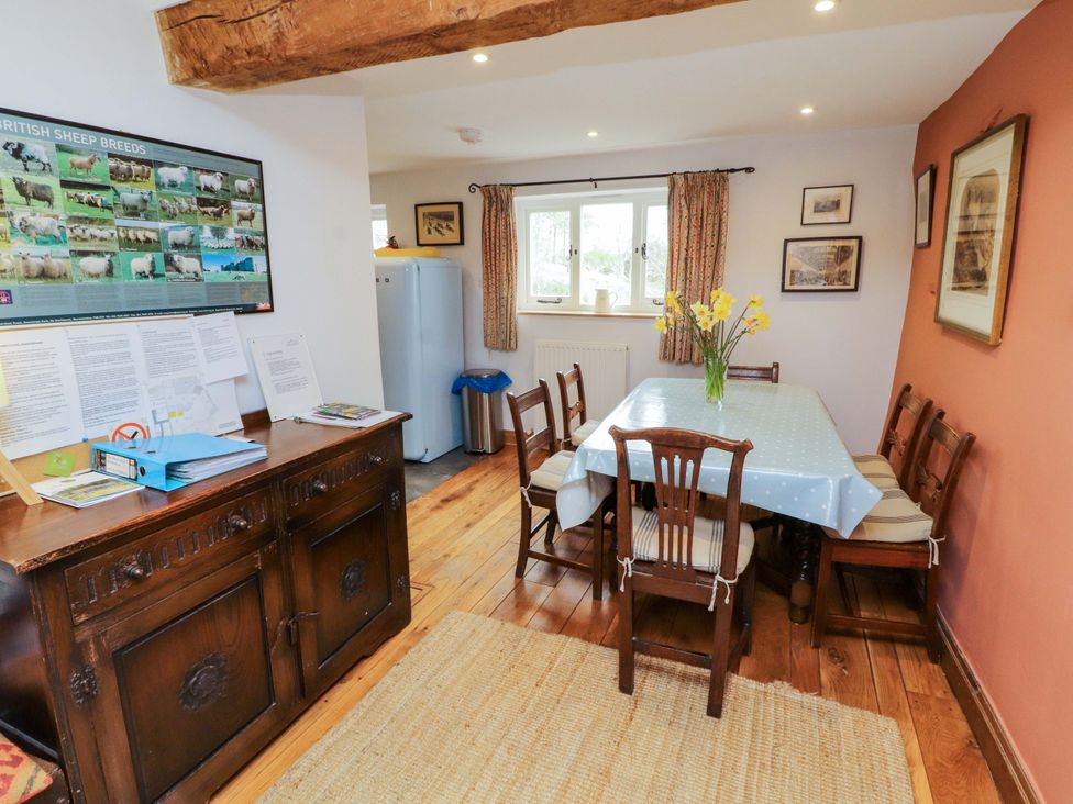 A dining room with a table and chairs at Two Town End in Mungrisdale, Mosedale