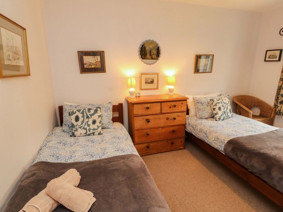 A bedroom with two beds and a dresser at Two Town End Mungrisdale, Mosedale