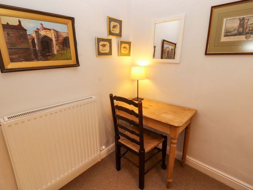 A study room with a desk and lamp at Two Town End in Mungrisdale, Mosedale