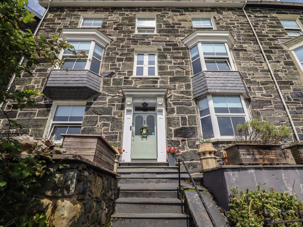 An entrance with steps and windows at 5 Porkington Terrace in Barmouth