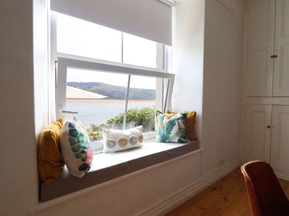 A window seat with cushions at 5 Porkington Terrace in Barmouth