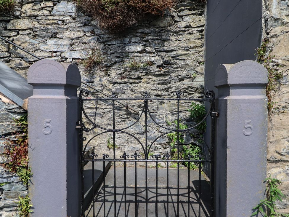A gate and stone wall at 5 Porkington Terrace in Barmouth