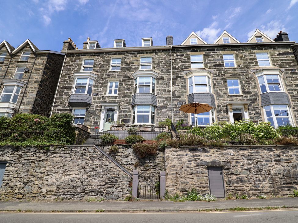 A stone building with windows and a door at 5 Porkington Terrace in Barmouth