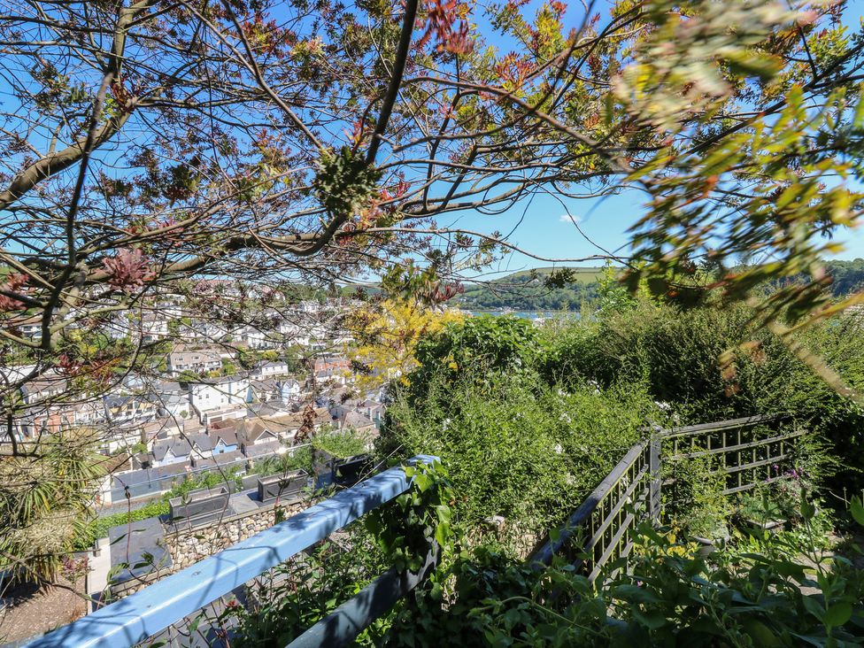 A garden with plants and a view of the town at 46 Crowthers Hill Dartmouth