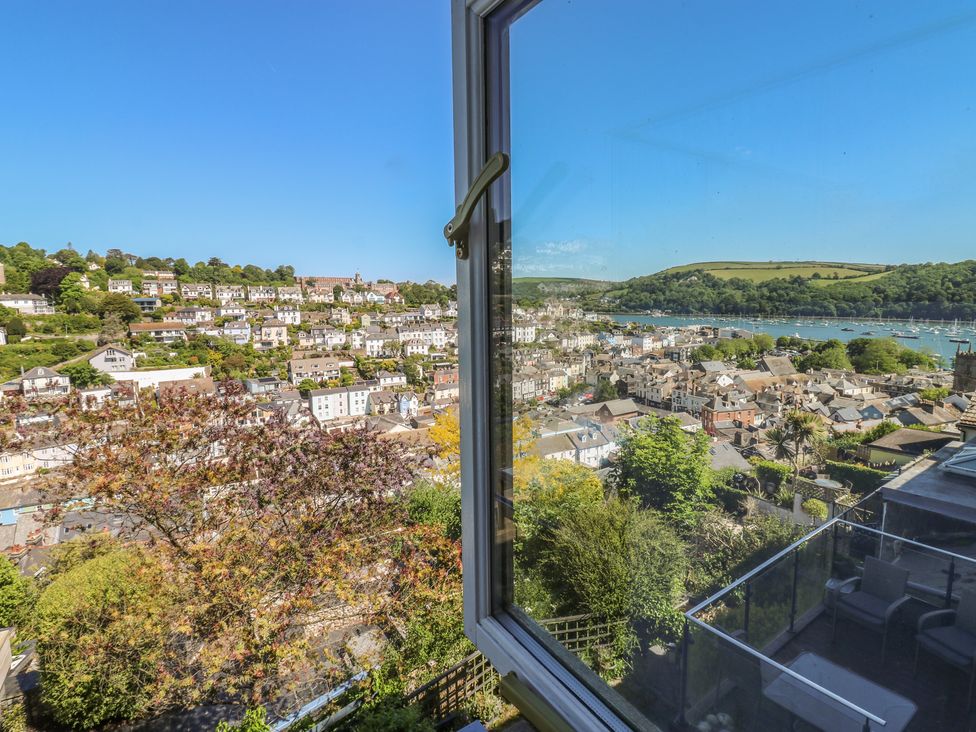 A view of houses and a river from a window at 46 Crowthers Hill in Dartmouth