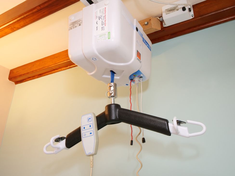 A ceiling hoist with a control panel at Scoresby Cottage @ Summerfield Farm, Hawsker