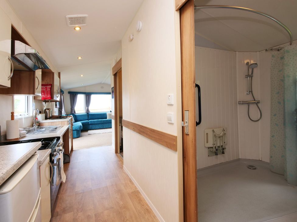 A kitchen with a shower area at Abbey View @ Summerfield Farm in Hawsker